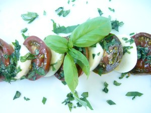 "Layered" Caprese Salad (made with heirloom tomatoes - they look green but are actually ripe)