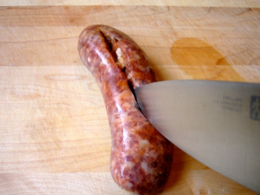 1. Slice the sausage lengthwise down the middle, making sure to pierce the skin but not cutting all the way through the sausage