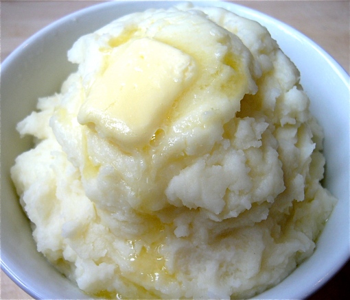 Creamy mashed potatoes with a pat of butter