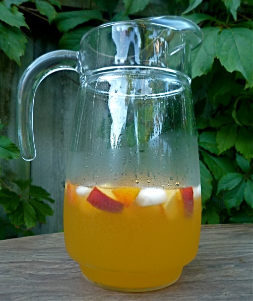 Ice cold peach sangria - the perfect refreshment on a hot August afternoon